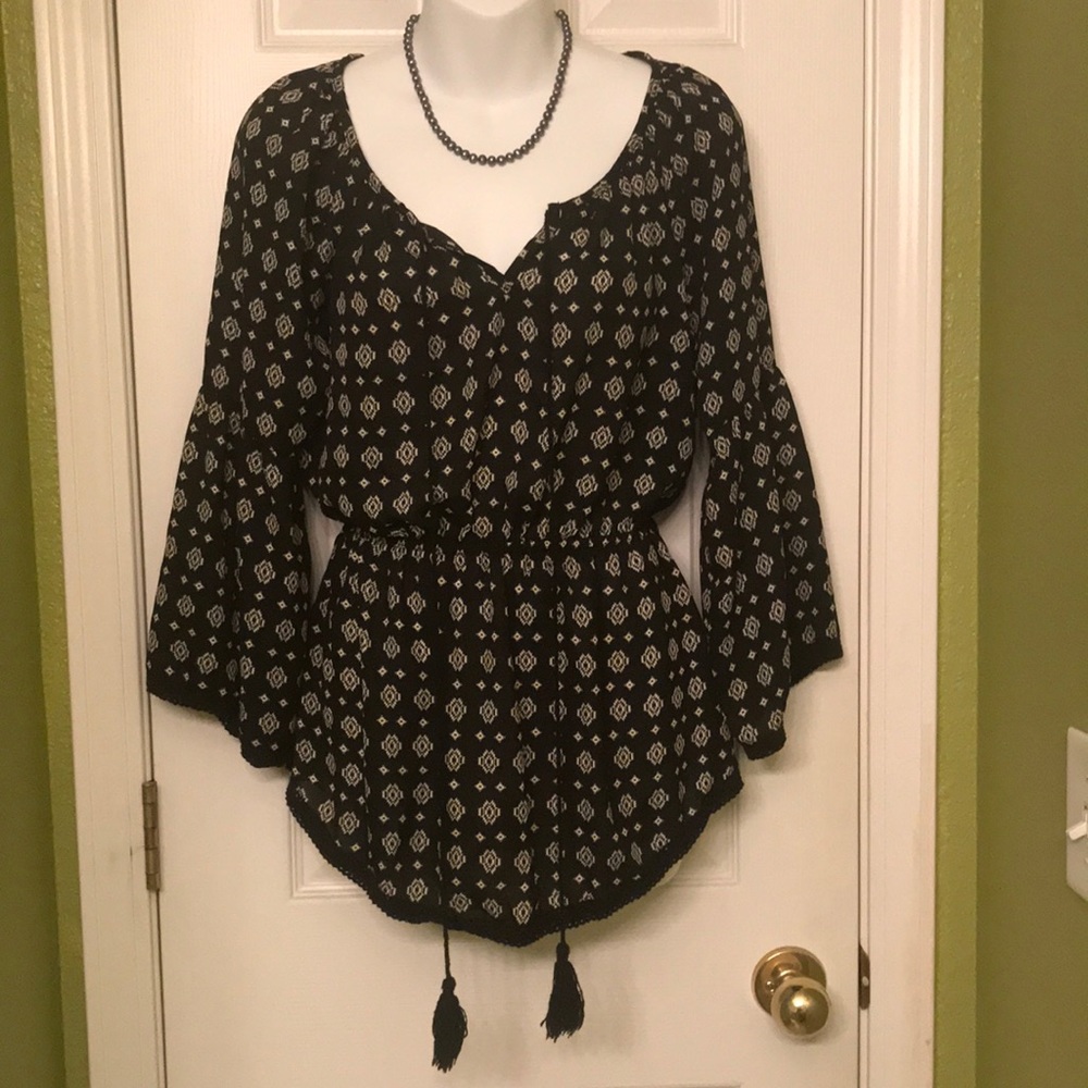 American Indian pattern on black polyester.  Cool, feminine, cotton lace detail.
